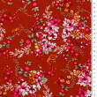 Viscose fabric flowers on red